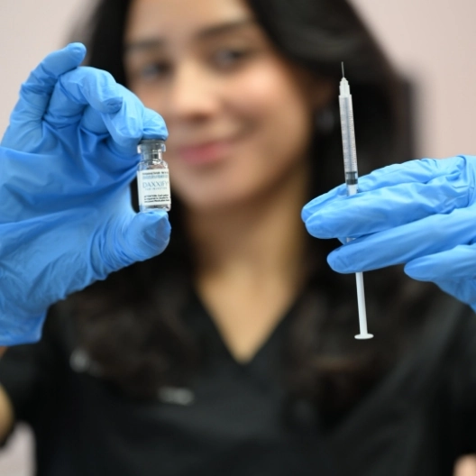 dermfx provider holding a vial of botox and needle
