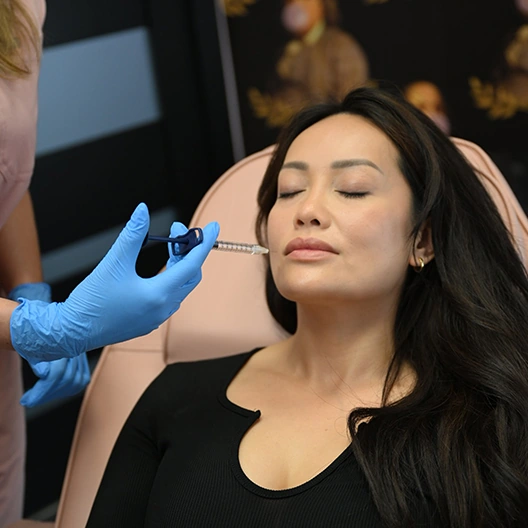 female client receiving injectables to treat smile lines