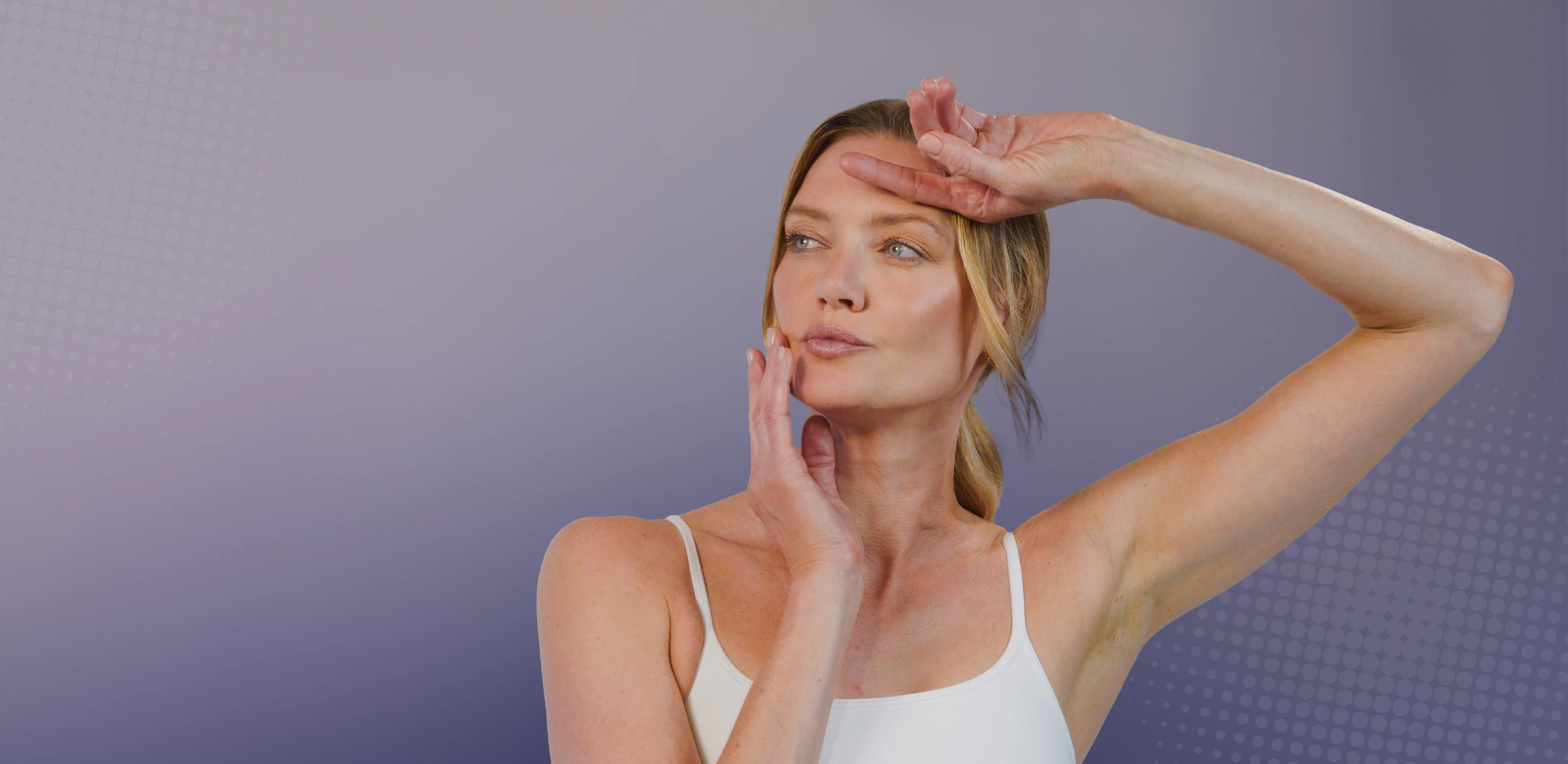 client with arm raised to her head