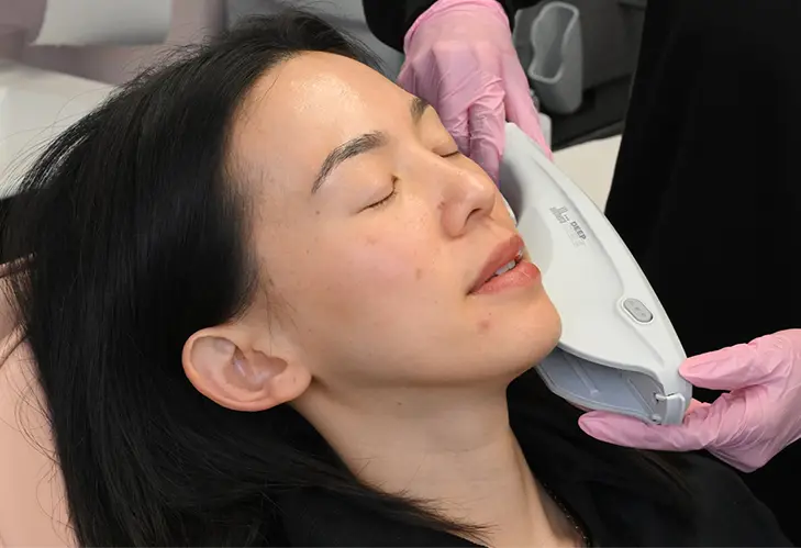 Ultherapy treatment on client